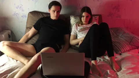 Bored of movie, she grabs his cock under laptop π β frame