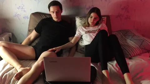 Bored of movie, she grabs his cock under laptop π β frame