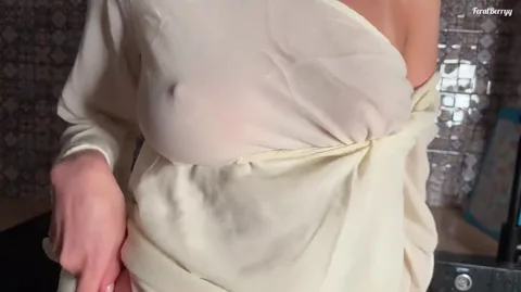 She's still sucking cock but already offering tits to cum on — frame