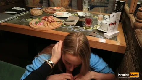 Climbed under table, sucked guy off, swallowed his cum — frame